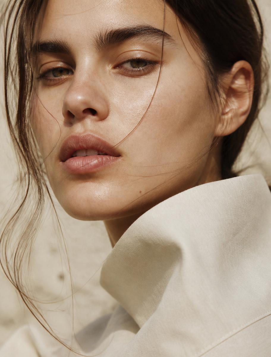 Close crop of a model's face in natural light